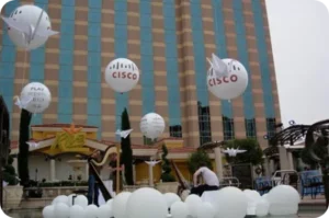 Floating balloons in front of a building.