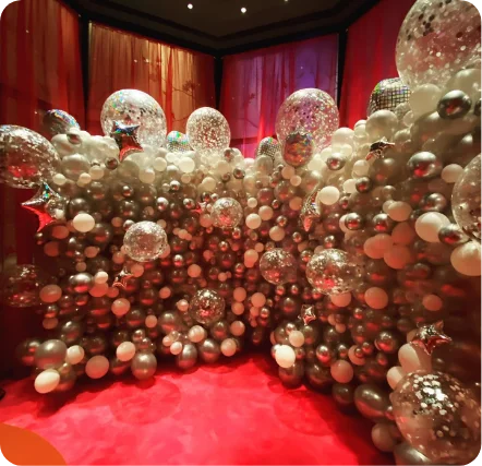 Balloon wall with stars and glittering spheres.