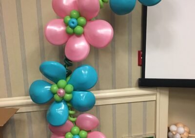 Balloon flowers decoration near exit sign.