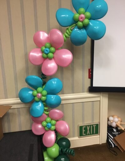 Balloon flowers decoration near exit sign.