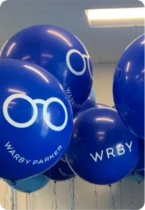 Blue balloons with Warby Parker logo design.
