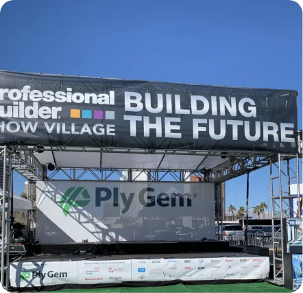 Outdoor stage with "Building the Future" banner.