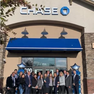 Group in front of Chase bank branch.