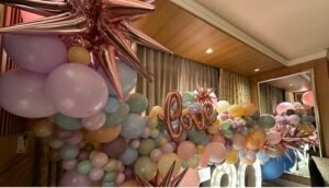 Colorful balloon decoration with "love" sign.
