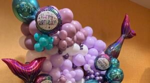 Mermaid-themed birthday balloon decoration display.