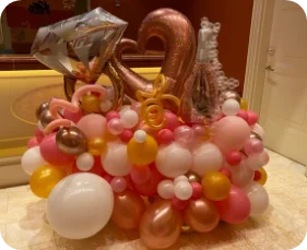 Colorful balloon arrangement with gold accents.